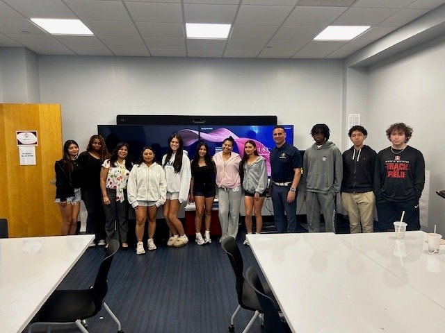 Dr. Tomei with students in classroom