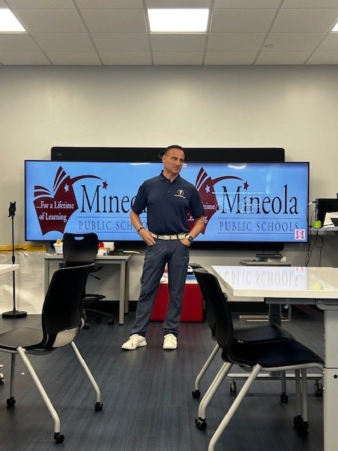 Dr. Tomei speaking at Mineola Public Schools